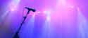 microphone on stage with purple lighting